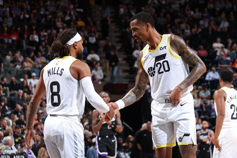 SALT LAKE CITY, UT - OCTOBER 15: John Collins #20 of the Utah Jazz high fives Patty Mills #8 during the game against the Sacramento Kings on October 15, 2024 at Delta Center in Salt Lake City, Utah. NOTE TO USER: User expressly acknowledges and agrees that, by downloading and or using this Photograph, User is consenting to the terms and conditions of the Getty Images License Agreement. Mandatory Copyright Notice: Copyright 2024 NBAE (Photo by Melissa Majchrzak/NBAE via Getty Images)