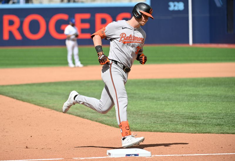 Jun 6, 2024; Toronto, Ontario, CAN;   Baltimore Orioles pinch hitter Ryan O'Hearn (32) rounds the bases after hitting a two run home run against the Toronto Blue Jays in the ninth inning at Rogers Centre. Mandatory Credit: Dan Hamilton-USA TODAY Sports