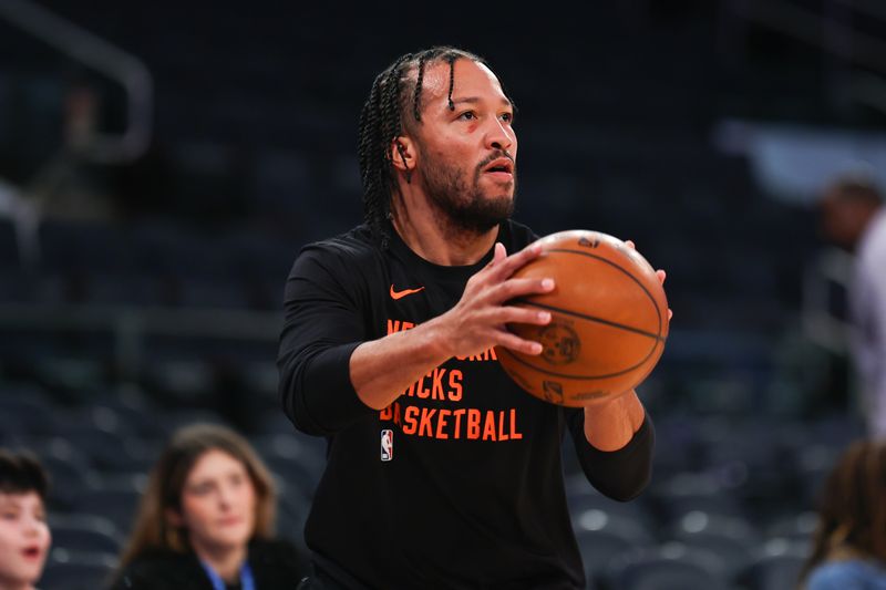 NEW YORK, NEW YORK - DECEMBER 25: Jalen Brunson #11 of the New York Knicks shoots during warm up prior to the game against the Milwaukee Bucks at Madison Square Garden on December 25, 2023 in New York City.  NOTE TO USER: User expressly acknowledges and agrees that, by downloading and or using this photograph, User is consenting to the terms and conditions of the Getty Images License Agreement. (Photo by Rich Graessle/Getty Images)