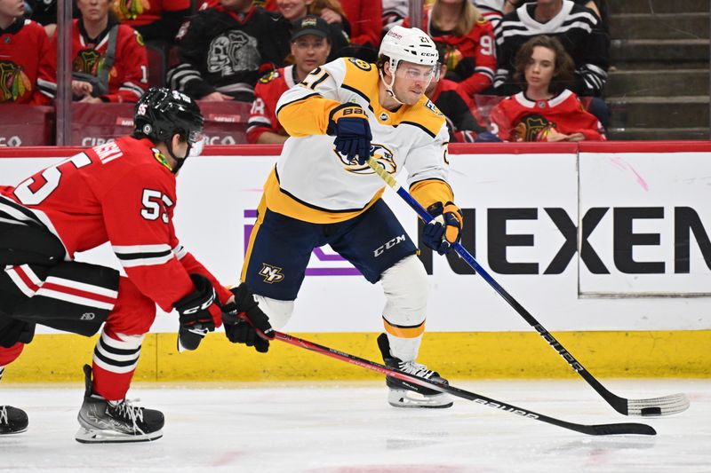 Apr 12, 2024; Chicago, Illinois, USA; Nashville Predators forward Anthony Beauvillier (21) shoots the puck in the third period against the Chicago Blackhawks at United Center. Mandatory Credit: Jamie Sabau-USA TODAY Sports