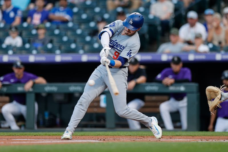 Sep 27, 2024; Denver, Colorado, USA; Los Angeles Dodgers second baseman Gavin Lux (9) hits a single in the first inning against the Colorado Rockies at Coors Field. Mandatory Credit: Isaiah J. Downing-Imagn Images