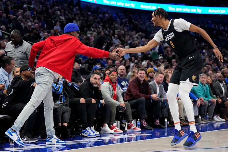 DALLAS, TEXAS - JANUARY 09: Ziaire Williams #8 of the Memphis Grizzlies is congratulated by Tee Morant, father of Ja Morant #12 of the Memphis Grizzlies, after making a 3-pt basket during the second half against the Dallas Mavericks at American Airlines Center on January 09, 2024 in Dallas, Texas. NOTE TO USER: User expressly acknowledges and agrees that, by downloading and or using this photograph, User is consenting to the terms and conditions of the Getty Images License Agreement. (Photo by Sam Hodde/Getty Images)