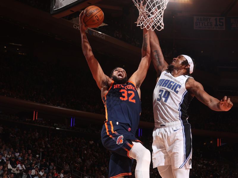 NEW YORK, NY - DECEMBER 3: Karl-Anthony Towns #32 of the New York Knicks drives to the basket during the game against the Orlando Magic during the Emirates NBA Cup on December 3, 2024 at Madison Square Garden in New York City, New York.  NOTE TO USER: User expressly acknowledges and agrees that, by downloading and or using this photograph, User is consenting to the terms and conditions of the Getty Images License Agreement. Mandatory Copyright Notice: Copyright 2024 NBAE  (Photo by Nathaniel S. Butler/NBAE via Getty Images)