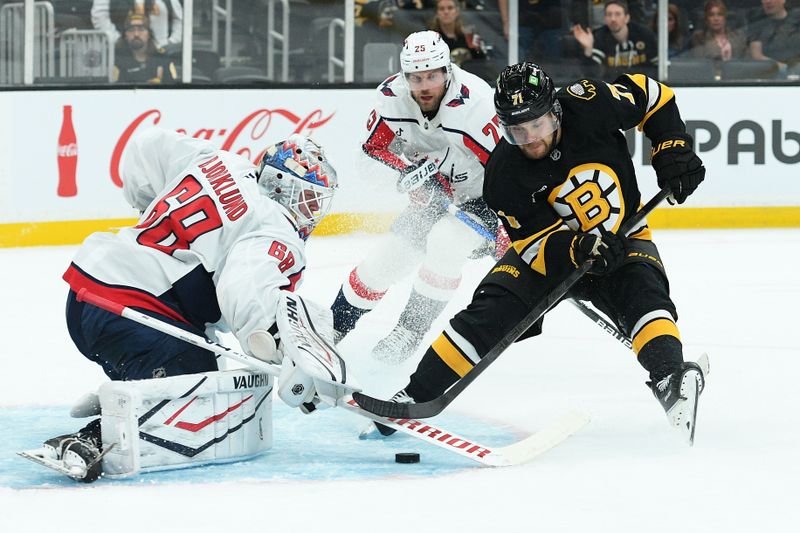 Sep 21, 2025; Boston, Massachusetts, USA; Washington Capitals goaltender Garin Bjorklund (68) makes a save on left wing Viktor Arvidsson (71) during the third period at TD Garden. Mandatory Credit: Bob DeChiara-Imagn Images