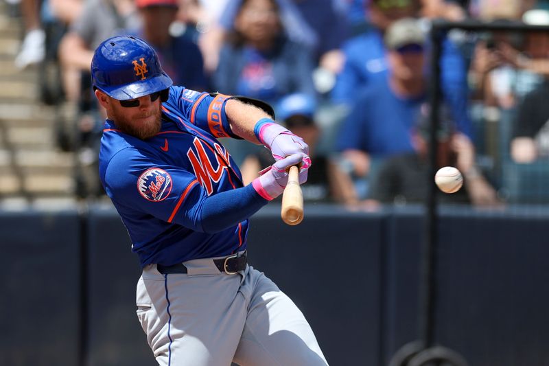 Mar 25, 2024; Tampa, Florida, USA;  New York Mets center fielder Harrison Bader (44) hits a base hit against the New York Yankees in the third inning at George M. Steinbrenner Field. Mandatory Credit: Nathan Ray Seebeck-USA TODAY Sports