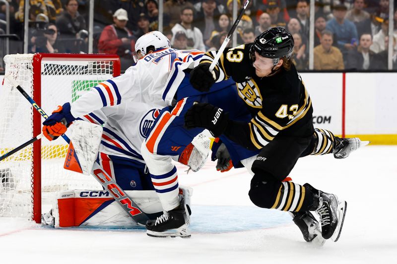 Mar 5, 2024; Boston, Massachusetts, USA; Boston Bruins left wing Danton Heinen (43) is upended in front of the net by Edmonton Oilers defenseman Vincent Desharnais (73) during the second period at TD Garden. Mandatory Credit: Winslow Townson-USA TODAY Sports