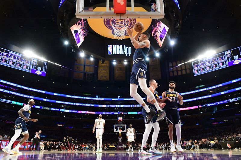 LOS ANGELES, CA - APRIL 27: Michael Porter Jr. #1 of the Denver Nuggets grabs a rebound during the game against the Los Angeles Lakers during Round 1 Game 4 of the 2024 NBA Playoffs on April 27, 2024 at Crypto.Com Arena in Los Angeles, California. NOTE TO USER: User expressly acknowledges and agrees that, by downloading and/or using this Photograph, user is consenting to the terms and conditions of the Getty Images License Agreement. Mandatory Copyright Notice: Copyright 2024 NBAE (Photo by Adam Pantozzi/NBAE via Getty Images)