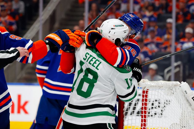 May 25, 2025; Edmonton, Alberta, CAN; Edmonton Oilers defenseman Jake Walman (96) and Dallas Stars center Sam Steel (18) get tangled up during the second period in game three of the Western Conference Final of the 2025 Stanley Cup Playoffs at Rogers Place. Mandatory Credit: Perry Nelson-Imagn Images