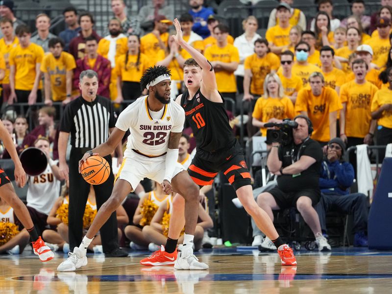 Mar 8, 2023; Las Vegas, NV, USA; Arizona State Sun Devils forward Warren Washington (22) dribbles against Oregon State Beavers forward Tyler Bilodeau (10) during the second half at T-Mobile Arena. Mandatory Credit: Stephen R. Sylvanie-USA TODAY Sports