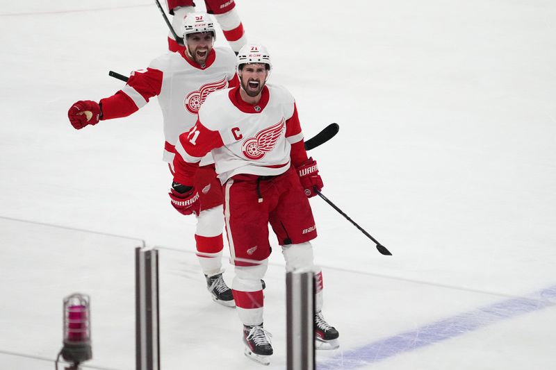 Jan 17, 2024; Sunrise, Florida, USA; Detroit Red Wings center Dylan Larkin (71) celebrates after scoring the game winning goal in overtime against the Florida Panthers at Amerant Bank Arena. Mandatory Credit: Jasen Vinlove-USA TODAY Sports