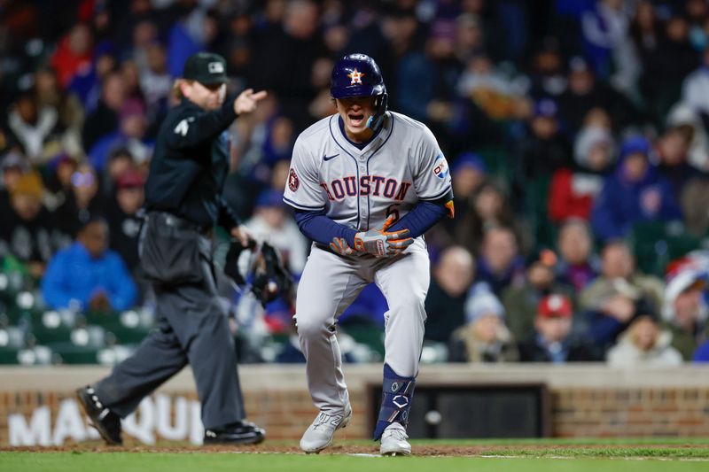 Apr 24, 2024; Chicago, Illinois, USA; Houston Astros outfielder Jake Meyers (6) reacts after being hit by a pitch from Chicago Cubs relief pitcher Adbert Alzolay during the fifth inning at Wrigley Field. Mandatory Credit: Kamil Krzaczynski-USA TODAY Sports
