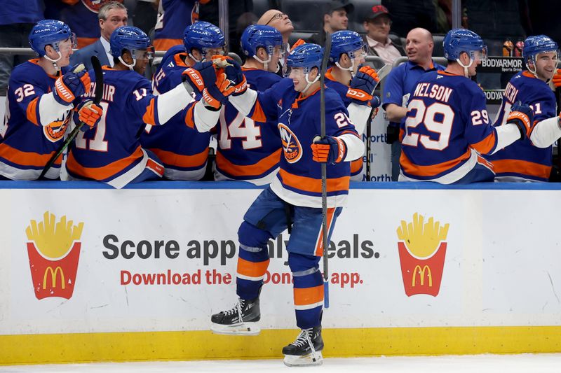 Jan 28, 2025; Elmont, New York, USA; New York Islanders defenseman Alexander Romanov (28) celebrates his goal against the Colorado Avalanche with teammates during the third period at UBS Arena. Mandatory Credit: Brad Penner-Imagn Images