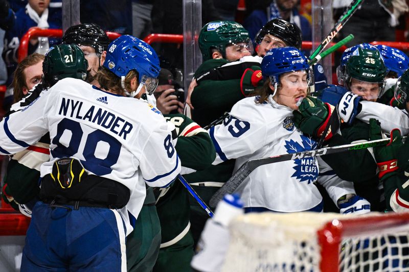 Nov 19, 2023; Stockholm, SWE; Toronto Maple Leafs right wing William Nylander (88) has to be separated from Minnesota Wild right wing Brandon Duhaime (21) during a Global Series NHL hockey game at Avicii Arena. Mandatory Credit: Per Haljestam-USA TODAY Sports