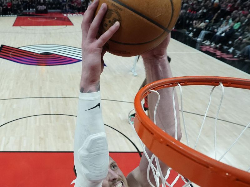 PORTLAND, OREGON - JANUARY 26: Isaiah Hartenstein #55 of the Oklahoma City Thunder dunks the ball during the second half against the Portland Trail Blazers at Moda Center on January 26, 2025 in Portland, Oregon. NOTE TO USER: User expressly acknowledges and agrees that, by downloading and or using this photograph, User is consenting to the terms and conditions of the Getty Images License Agreement. (Photo by Soobum Im/Getty Images)