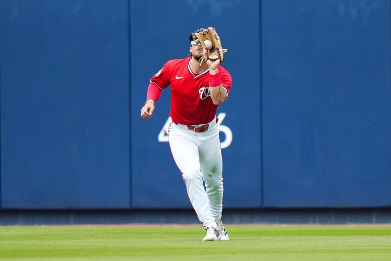 Mar 4, 2025; West Palm Beach, Florida, USA; Washington Nationals outfielder Dylan Crews (3) catches the ball for an out against the St. Louis Cardinals during the fourth inning at CACTI Park of the Palm Beaches. Mandatory Credit: Rich Storry-Imagn Images