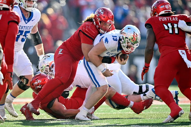 Nov 25, 2023; Louisville, Kentucky, USA;  Louisville Cardinals defensive lineman Ashton Gillotte (9) sacks Kentucky Wildcats quarterback Devin Leary (13) during the second half at L&N Federal Credit Union Stadium. Kentucky defeated Louisville 38-31. Mandatory Credit: Jamie Rhodes-USA TODAY Sports