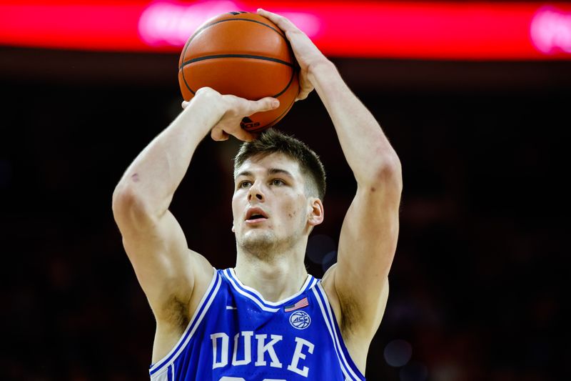 Jan 4, 2023; Raleigh, North Carolina, USA;  Duke Blue Devils center Kyle Filipowski (30) shoots a free throw during the second half against North Carolina State Wolfpack at PNC Arena. Mandatory Credit: Jaylynn Nash-USA TODAY Sports