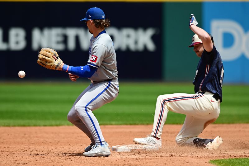 Jun 6, 2024; Cleveland, Ohio, USA; Cleveland Guardians first baseman Kyle Manzardo (9) slides into second with a double as Kansas City Royals shortstop Bobby Witt Jr. (7) waits for the throw during the third inning at Progressive Field. Mandatory Credit: Ken Blaze-USA TODAY Sports