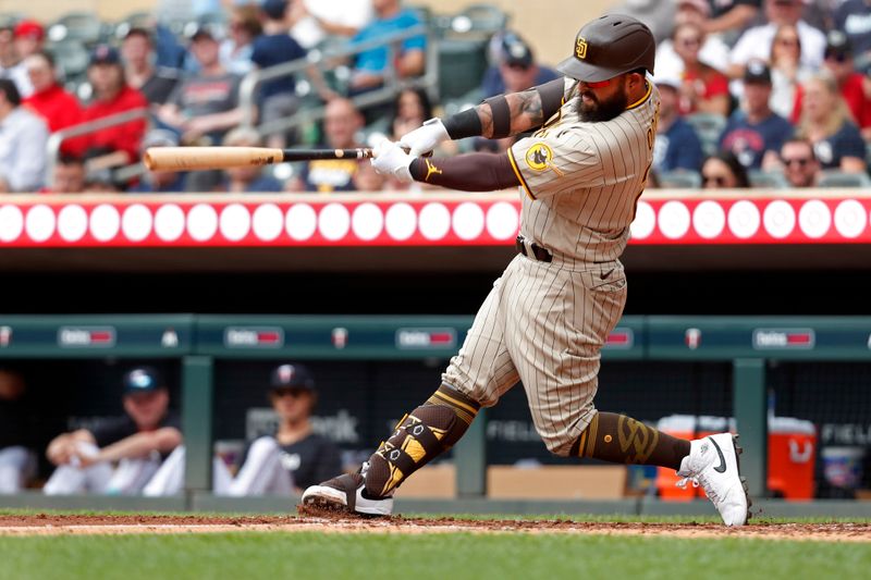 May 11, 2023; Minneapolis, Minnesota, USA; San Diego Padres second baseman Rougned Odor (24) hits a solo home run against the Minnesota Twins in the fifth inning at Target Field. Mandatory Credit: Bruce Kluckhohn-USA TODAY Sports