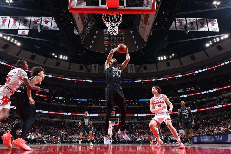 CHICAGO, IL - DECEMBER 2: Nicolas Claxton #33 of the Brooklyn Nets rebounds the ball during the game against the Chicago Bulls on December 2, 2024 at United Center in Chicago, Illinois. NOTE TO USER: User expressly acknowledges and agrees that, by downloading and or using this photograph, User is consenting to the terms and conditions of the Getty Images License Agreement. Mandatory Copyright Notice: Copyright 2024 NBAE (Photo by Jeff Haynes/NBAE via Getty Images)