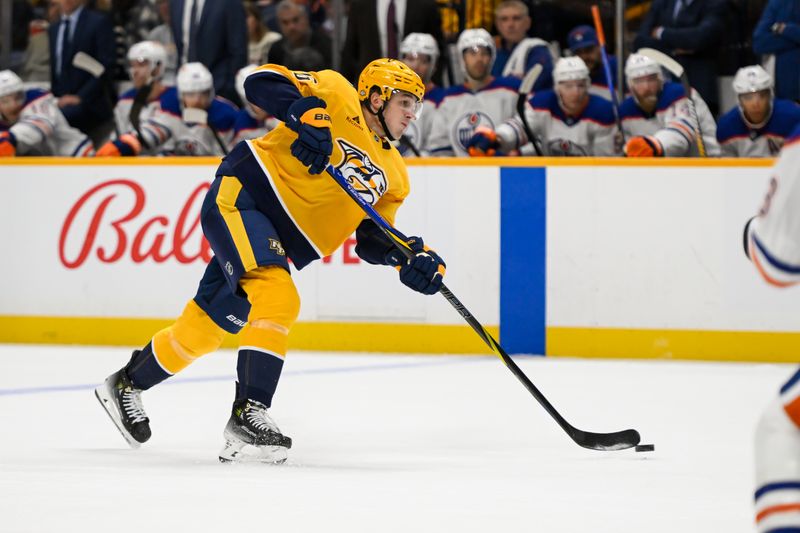 Oct 17, 2024; Nashville, Tennessee, USA;  Nashville Predators left wing Cole Smith (36) takes a shot on goal against the Edmonton Oilers during the first period at Bridgestone Arena. Mandatory Credit: Steve Roberts-Imagn Images