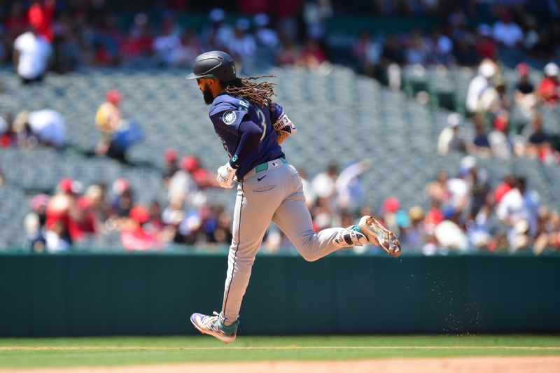 Jul 14, 2024; Anaheim, California, USA; Seattle Mariners shortstop J.P. Crawford (3) runs the bases after hitting a solo home run against the Los Angeles Angels during the sixth inning at Angel Stadium. Mandatory Credit: Gary A. Vasquez-USA TODAY Sports