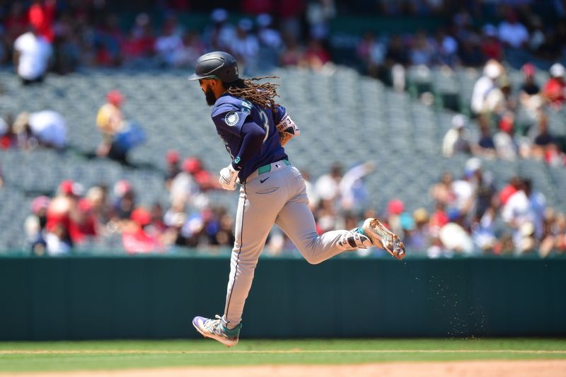 Jul 14, 2024; Anaheim, California, USA; Seattle Mariners shortstop J.P. Crawford (3) runs the bases after hitting a solo home run against the Los Angeles Angels during the sixth inning at Angel Stadium. Mandatory Credit: Gary A. Vasquez-USA TODAY Sports