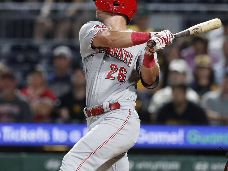 Aug 13, 2023; Pittsburgh, PA, USA; Cincinnati Reds right fielder TJ Hopkins (26) hits a single against the Pittsburgh Pirates during the tenth inning at PNC Park. The Reds won 6-5 in ten innings. Mandatory Credit: Charles LeClaire-USA TODAY Sports