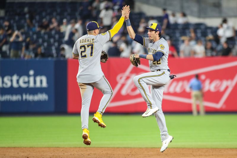 Sep 8, 2023; Bronx, New York, USA;  Milwaukee Brewers shortstop Willy Adames (27) and left fielder Christian Yelich (22) celebrate after defeating the New York Yankees at Yankee Stadium. Mandatory Credit: Wendell Cruz-USA TODAY Sports