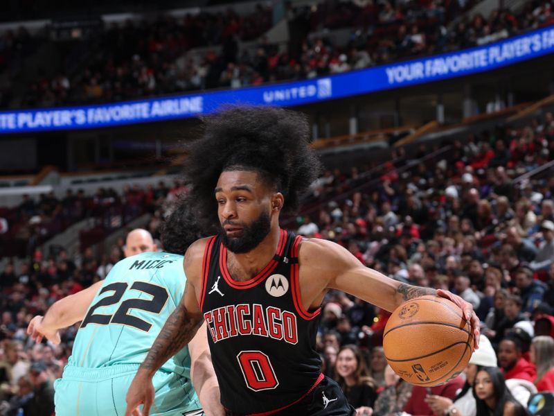 CHICAGO, IL - DECEMBER 13: Coby White #0 of the Chicago Bulls dribbles the ball during the game against the Charlotte Hornets on December 13, 2024 at United Center in Chicago, Illinois. NOTE TO USER: User expressly acknowledges and agrees that, by downloading and or using this photograph, User is consenting to the terms and conditions of the Getty Images License Agreement. Mandatory Copyright Notice: Copyright 2024 NBAE (Photo by Jeff Haynes/NBAE via Getty Images)