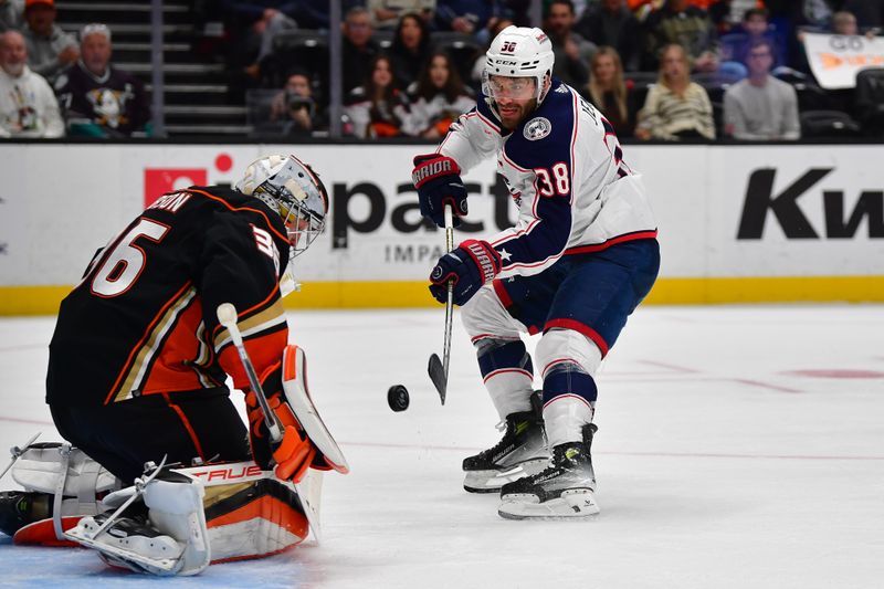 Feb 21, 2024; Anaheim, California, USA; Columbus Blue Jackets center Boone Jenner (38) shoots on goal against Anaheim Ducks goaltender John Gibson (36) during the second period at Honda Center. Mandatory Credit: Gary A. Vasquez-USA TODAY Sports