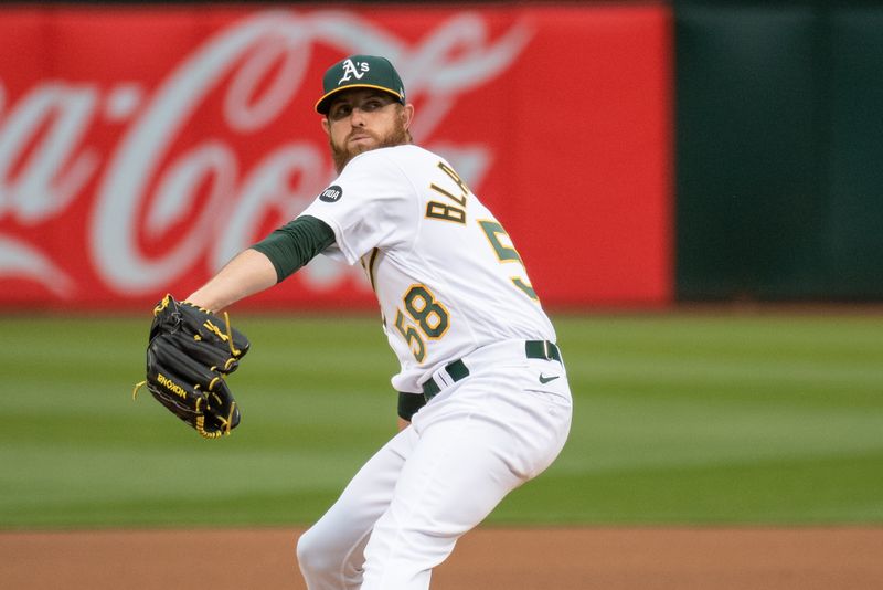 Jun 27, 2023; Oakland, California, USA; Oakland Athletics starting pitcher Paul Blackburn (58) throws a pitch during the fourth inning against the New York Yankees at Oakland-Alameda County Coliseum. Mandatory Credit: Ed Szczepanski-USA TODAY Sports