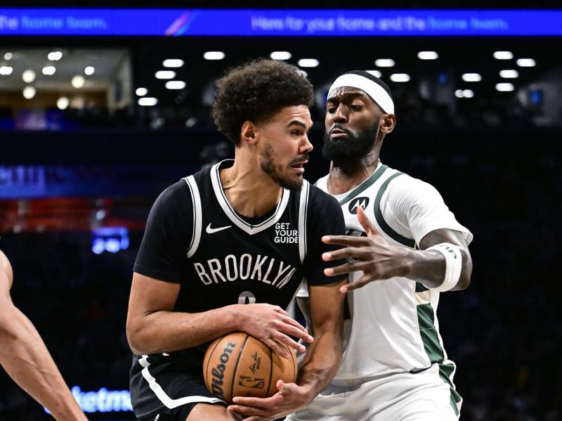 NEW YORK, NEW YORK - DECEMBER 08: Cameron Johnson #2 of the Brooklyn Nets is defended by Bobby Portis #9 of the Milwaukee Bucks during the second half at Barclays Center on December 08, 2024 in New York City. NOTE TO USER: User expressly acknowledges and agrees that, by downloading and or using this Photograph, user is consenting to the terms and conditions of the Getty Images License Agreement. (Photo by Steven Ryan/Getty Images)