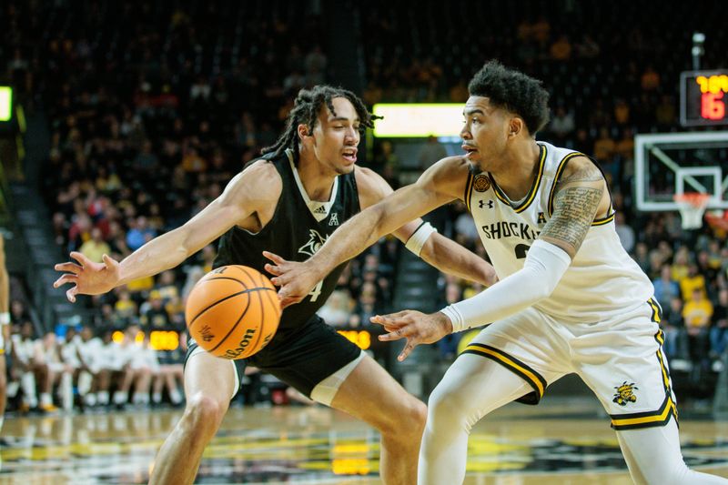 Mar 2, 2024; Wichita, Kansas, USA; Wichita State Shockers forward Ronnie DeGray III (3) passes the ball around Rice Owls guard Anthony Selden (4) during the first half at Charles Koch Arena. Mandatory Credit: William Purnell-USA TODAY Sports