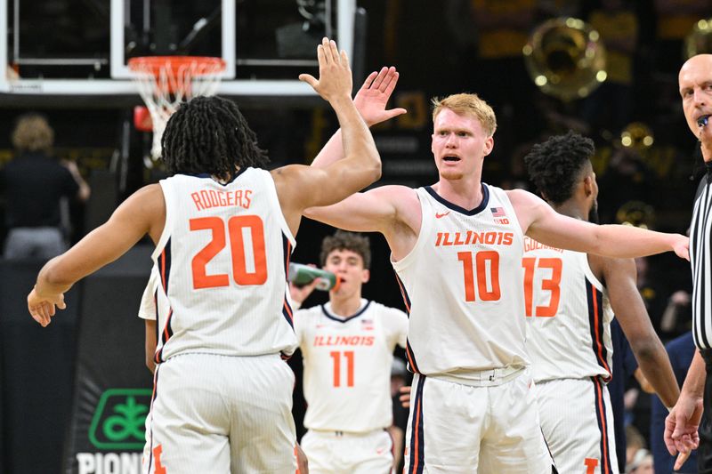 Mar 10, 2024; Iowa City, Iowa, USA; Illinois Fighting Illini guard Luke Goode (10) reacts with forward Ty Rodgers (20) during the first half against the Iowa Hawkeyes at Carver-Hawkeye Arena. Mandatory Credit: Jeffrey Becker-USA TODAY Sports