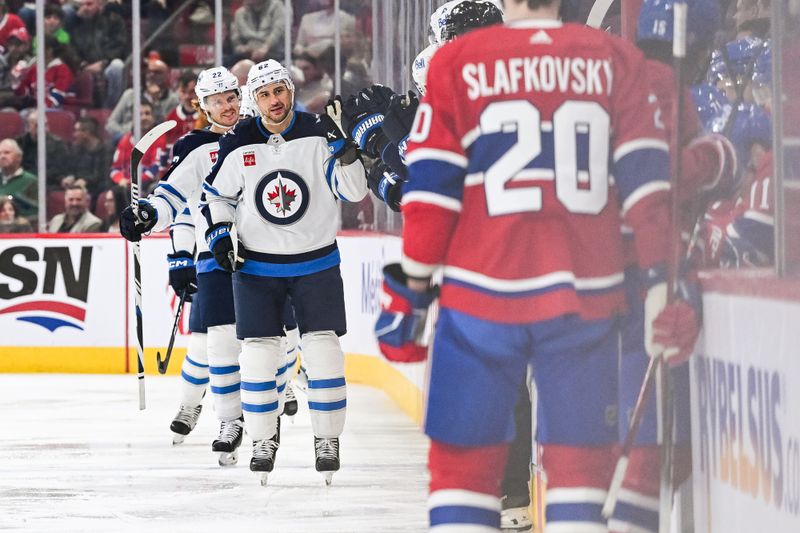 Oct 28, 2023; Montreal, Quebec, CAN; Winnipeg Jets right wing Nino Niederreiter (62) celebrates his goal against the Montreal Canadiens with his teammates at the bench during the second period at Bell Centre. Mandatory Credit: David Kirouac-USA TODAY Sports