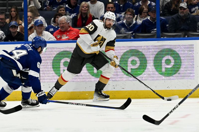 Dec 21, 2023; Tampa, Florida, USA; Las Vegas Golden Knights center Chandler Stephenson (20) looks for an open teammate in the second period against the Tampa Bay Lightning at Amalie Arena. Mandatory Credit: Jonathan Dyer-USA TODAY Sports