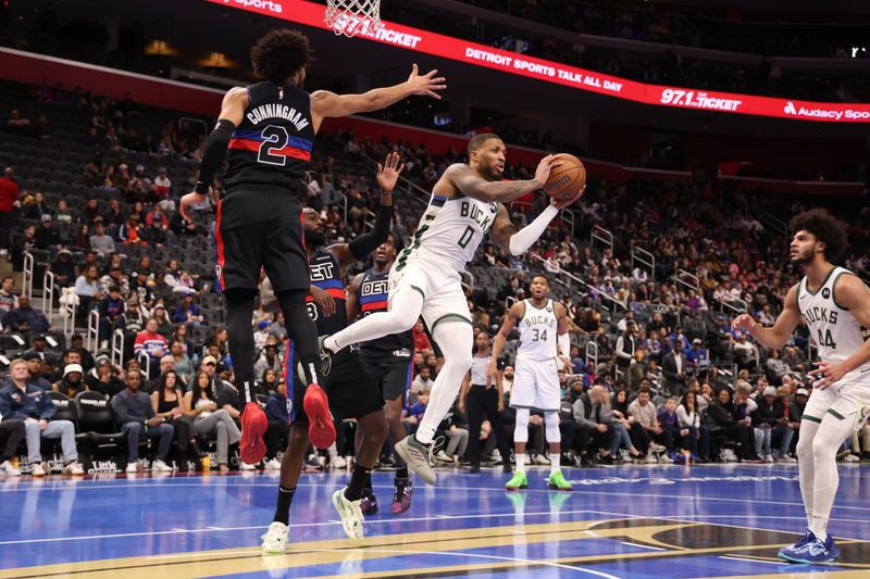 DETROIT, MICHIGAN - DECEMBER 03: Damian Lillard #0 of the Milwaukee Bucks passes away from Cade Cunningham #2 of the Detroit Pistons during the first half of a NBA Cup game at Little Caesars Arena on December 03, 2024 in Detroit, Michigan. NOTE TO USER: User expressly acknowledges and agrees that, by downloading and or using this photograph, User is consenting to the terms and conditions of the Getty Images License. (Photo by Gregory Shamus/Getty Images)