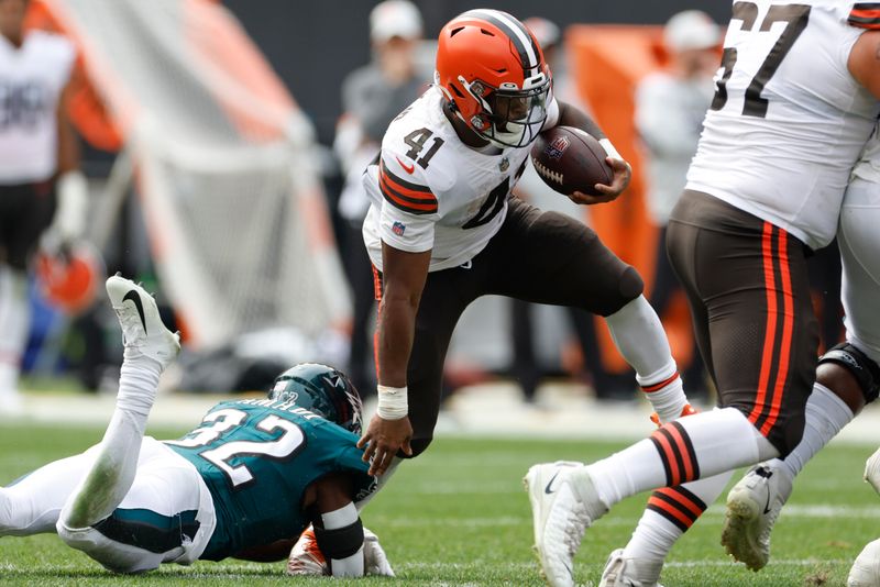 Cleveland Browns running back John Kelly Jr. (41) tries to get away from Philadelphia Eagles running back Jason Huntley (32) during the second half of an NFL preseason football game in Cleveland, Sunday, Aug. 21, 2022. (AP Photo/Ron Schwane)