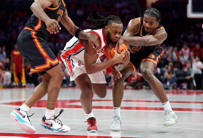 Feb 11, 2026; Columbus, Ohio, USA;  Ohio State Buckeyes guard Bruce Thornton (2) drives to the basket as USC Trojans guard Cam Woods (13) and USC Trojans forward Ezra Ausar (2) defend during the second half at Value City Arena. Mandatory Credit: Joseph Maiorana-Imagn Images
