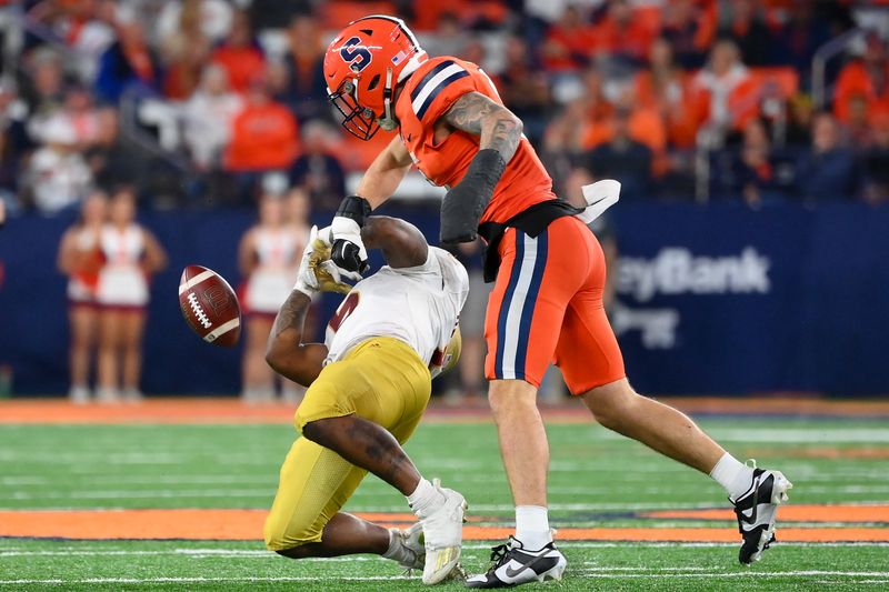 Nov 3, 2023; Syracuse, New York, USA; Syracuse Orange defensive back Justin Barron (8) hits Boston College Eagles running back Kye Robichaux (5) causing a fumble during the second half at the JMA Wireless Dome. Mandatory Credit: Rich Barnes-USA TODAY Sports