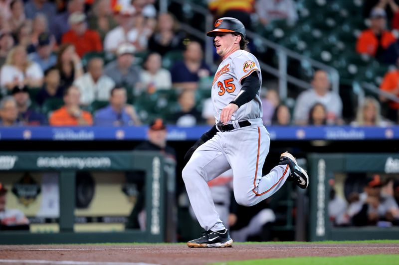 Sep 20, 2023; Houston, Texas, USA; Baltimore Orioles catcher Adley Rutschman (35) runs towards home plate to score a run against the Houston Astros during the first inning at Minute Maid Park. Mandatory Credit: Erik Williams-USA TODAY Sports