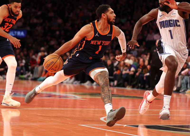 NEW YORK, NEW YORK - DECEMBER 03: Cameron Payne #1 of the New York Knicks dribbles against the Orlando Magic during their game at Madison Square Garden on December 03, 2024 in New York City.   User expressly acknowledges and agrees that, by downloading and or using this photograph, User is consenting to the terms and conditions of the Getty Images License Agreement.  (Photo by Al Bello/Getty Images)