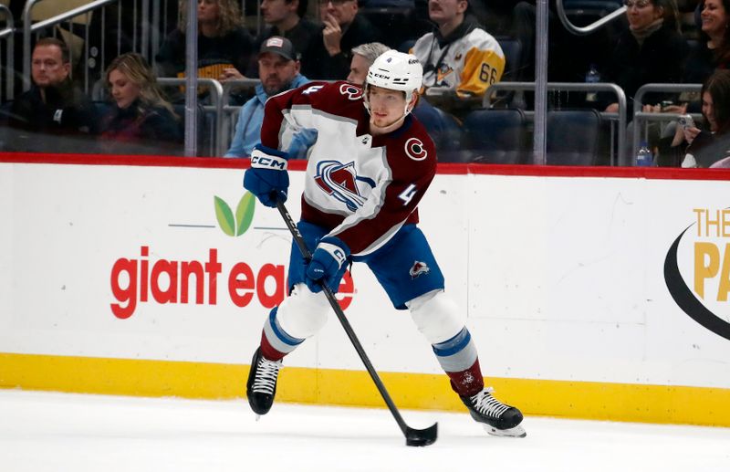 Oct 26, 2023; Pittsburgh, Pennsylvania, USA; Colorado Avalanche defenseman Bowen Byram (4) moves the puck against the Pittsburgh Penguins during the first period at PPG Paints Arena. Mandatory Credit: Charles LeClaire-USA TODAY Sports