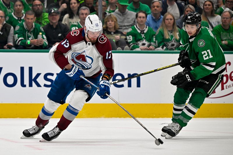 May 7, 2024; Dallas, Texas, USA; Colorado Avalanche right wing Valeri Nichushkin (13) and Dallas Stars left wing Jason Robertson (21) chase the puck during the second period in game one of the second round of the 2024 Stanley Cup Playoffs at American Airlines Center. Mandatory Credit: Jerome Miron-USA TODAY Sports