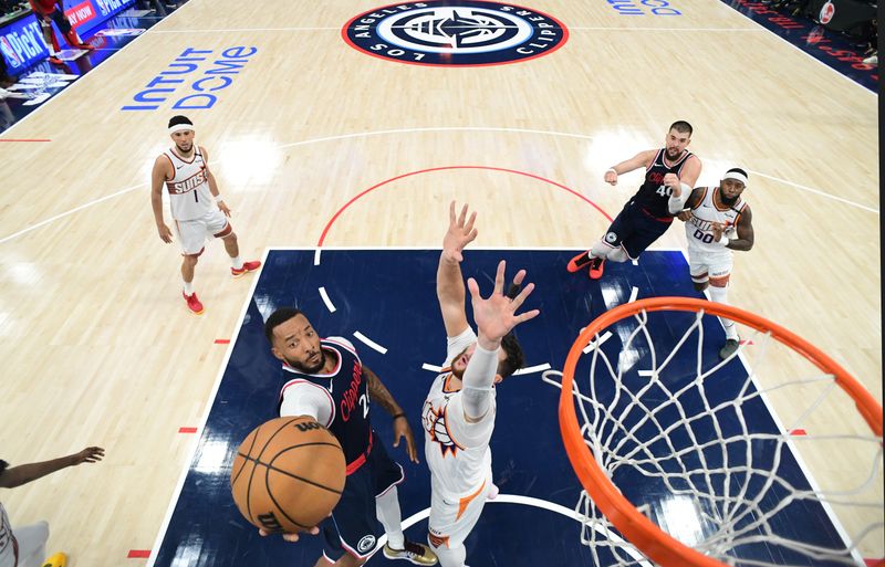 INGLEWOOD, CA - OCTOBER 23: Norman Powell #24 of the LA Clippers drives to the basket during the game against the Phoenix Suns on October 23, 2024 at Intuit Dome in Los Angeles, California. NOTE TO USER: User expressly acknowledges and agrees that, by downloading and/or using this Photograph, user is consenting to the terms and conditions of the Getty Images License Agreement. Mandatory Copyright Notice: Copyright 2024 NBAE (Photo by Adam Pantozzi/NBAE via Getty Images)