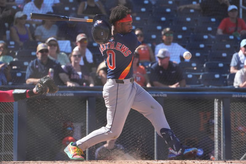 Feb 21, 2026; West Palm Beach, Florida, USA; Brice Matthews (0) of the Houston Astros loses his helmet swinging at a pitch in the fifth inning against the Washington Nationals at CACTI Park of the Palm Beaches. Mandatory Credit: Jim Rassol-Imagn Images