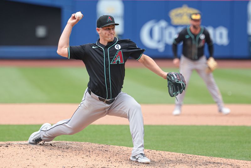 Jun 2, 2024; New York City, New York, USA; Arizona Diamondbacks relief pitcher Paul Sewald (38) delivers a pitch during the ninth inning against the New York Mets at Citi Field. Mandatory Credit: Vincent Carchietta-USA TODAY Sports