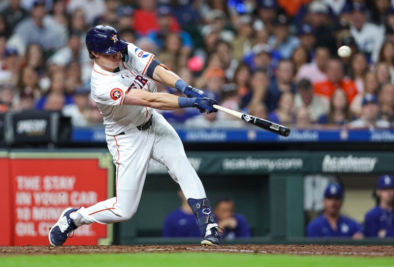 Jul 27, 2024; Houston, Texas, USA; Houston Astros center fielder Jake Meyers (6) hits an RBI single during the sixth inning against the Los Angeles Dodgers at Minute Maid Park. Mandatory Credit: Troy Taormina-USA TODAY Sports