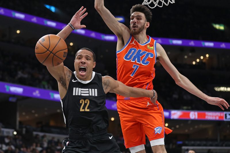 MEMPHIS, TENNESSEE - MARCH 16: Desmond Bane #22 of the Memphis Grizzlies goes for the ball during the second half against Chet Holmgren #7 of the Oklahoma City Thunder at FedExForum on March 16, 2024 in Memphis, Tennessee. NOTE TO USER: User expressly acknowledges and agrees that, by downloading and or using this photograph, User is consenting to the terms and conditions of the Getty Images License Agreement. (Photo by Justin Ford/Getty Images)